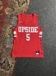 • This red Nike women's Dri-FIT basketball jersey "UPSIDE"  number 5.